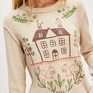 Free People We The Free Cream Sweater with Green and Brown Accents.